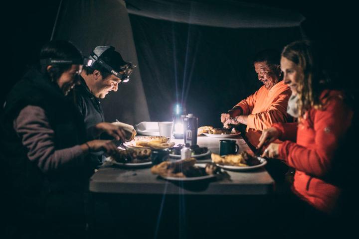 people eating in a tent
