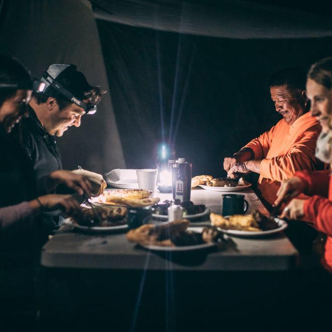 people eating in a tent