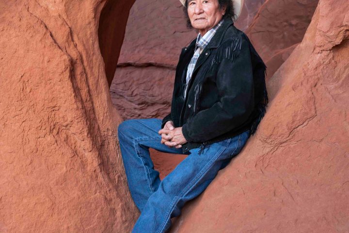 a man sitting on a rock