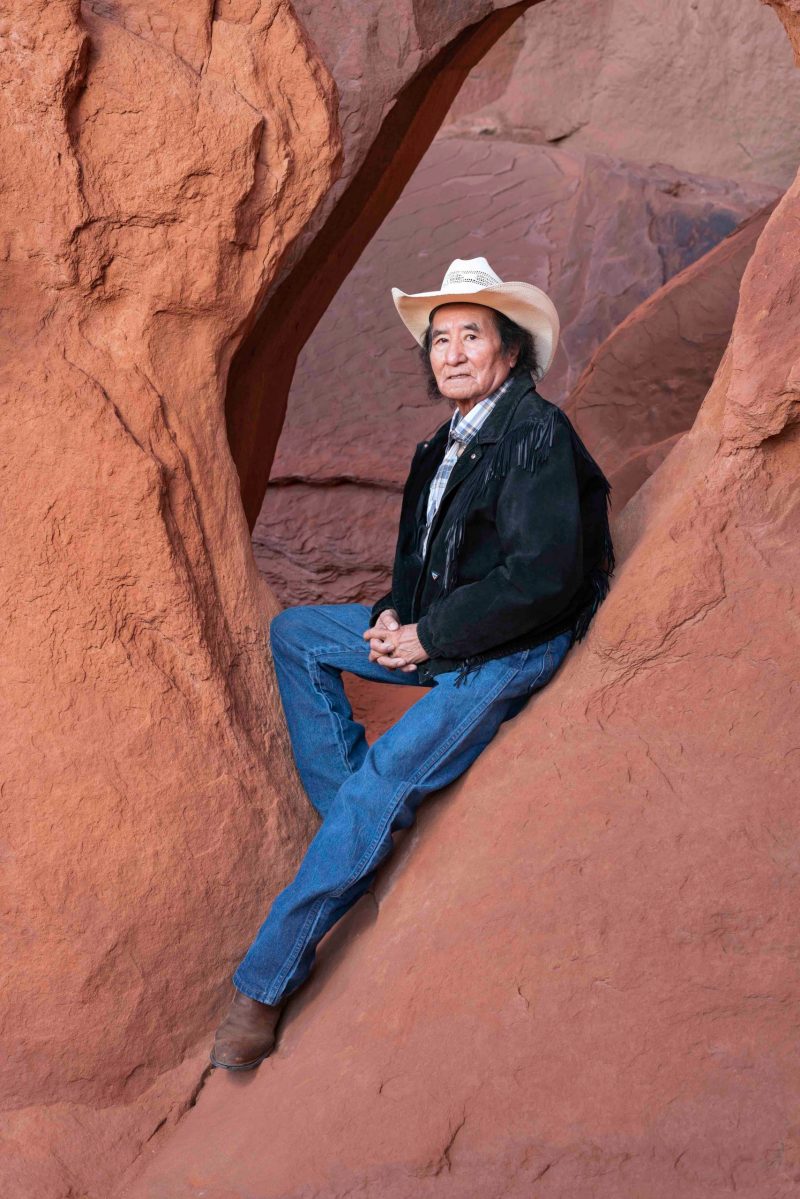 a man sitting on a rock