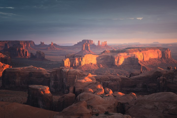 a canyon with a sunset in the background