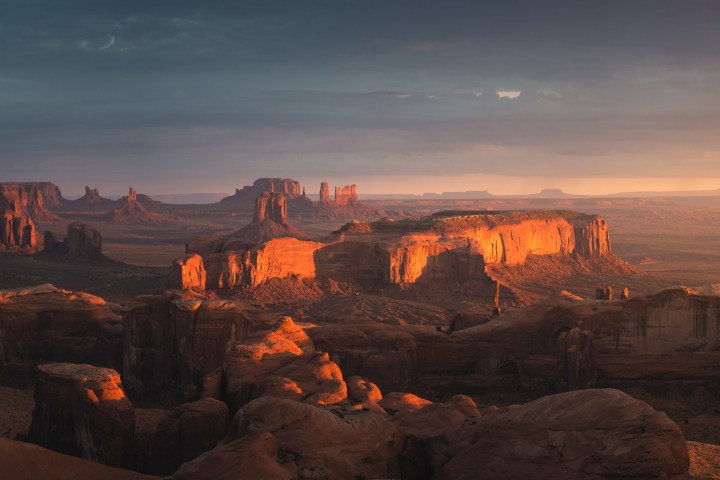 a canyon with a sunset in the background