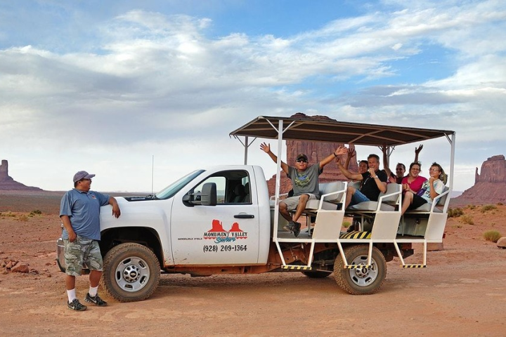 a small truck parked on the beach